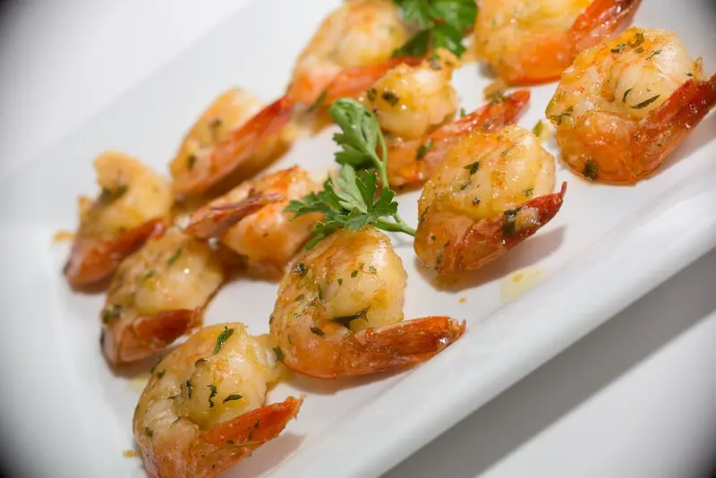 Close-up of garlic shrimp with parsley