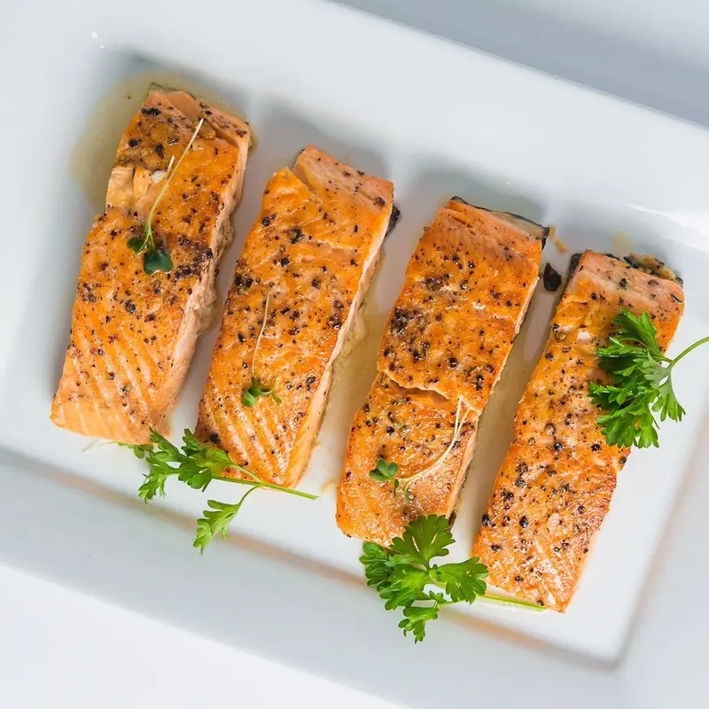 Pan-roasted salmon fillets with fresh parsley