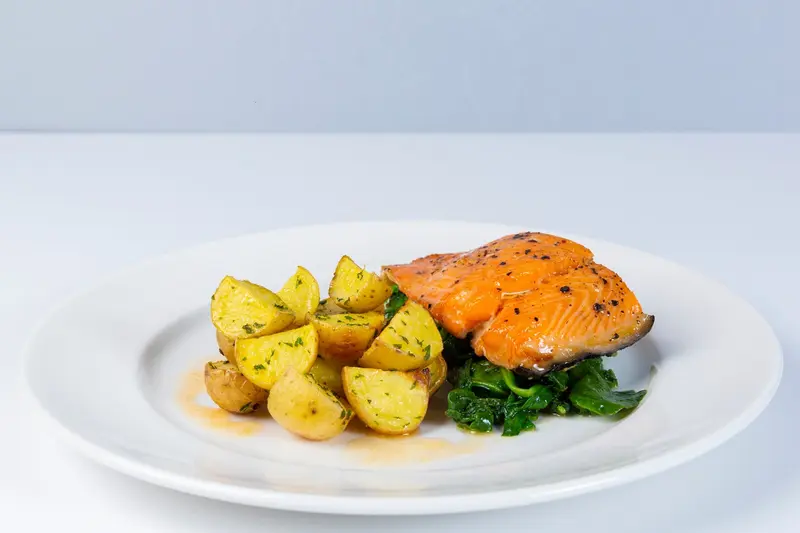 Pan-roasted salmon with wilted spinach and roasted potatoes