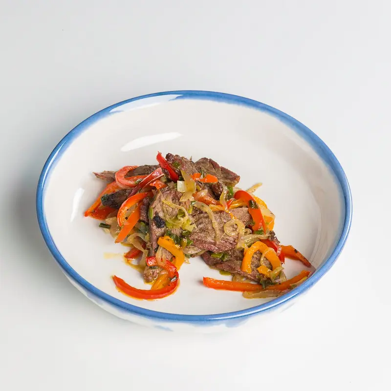 Grilled beef with fried rice and peppers